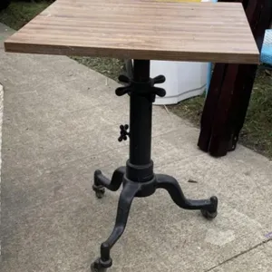 Table with Iron Rolling Base