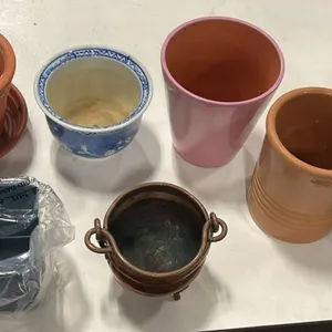 7 Assorted Flower Pots and a Storage Container