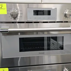 2021 Thermador MC30WP/01 30" built-in convection microwave oven. Features a stainless steel finish, pull-down door, and multiple cook modes. Includes 