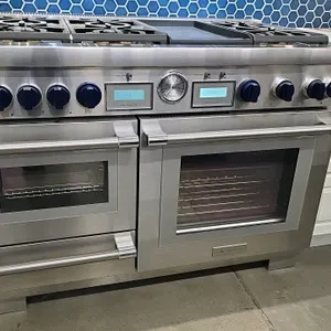 Thermador PRD48WDSGU/05 48" dual-fuel range. Features 6 star burners, 12" griddle, 30" baking oven, and 12" steam oven. Stainless steel finish. Gas ty