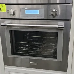 Thermador PODMC301W/03 built-in convection oven. Features a stainless steel finish, digital display, rotisserie, multiple cooking modes, and interior 
