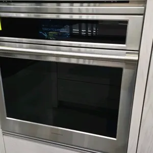 Monogram ZTSX1DPSN1SS built-in convection oven. Features a stainless steel finish, glass door, and digital touch screen controls with WiFi connectivit