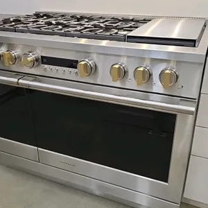 Monogram ZDP486NDT1SS 48" dual fuel range. Features a 6-burner gas cooktop with cast iron grates, a 12" griddle, a 30" electric baking oven, and a 12"