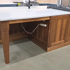 Kraftmaid 92"x66" wood island cabinet suite. Features white countertop. Includes 2022 Dacor DMR24M977WS 24" stainless steel microwave drawer, 2025 Dac