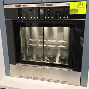 Dacor DWS4000BB built-in wine dispenser. Features a black glass and stainless steel finish, single glass door, digital touch control panel, and 4-bott