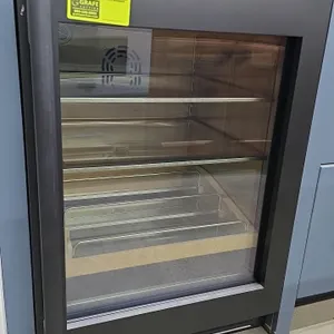 2025 Dacor DRR24G7400AP undercounter glass door refrigerator. Features a single glass door with a matte black finish frame, stainless steel interior, 