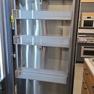 2022 Dacor DRR30980RAP 48" built-in refrigerator and freezer. Features a stainless steel interior, glass shelves, door bins, and an internal ice maker