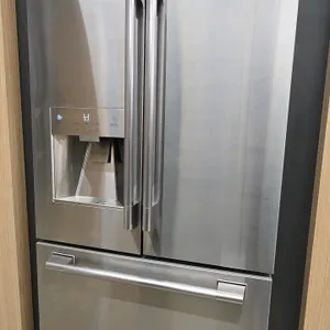 2024 Signature Kitchen Suite SKSFD3623SD French door refrigerator. Features a stainless steel finish, exterior ice/water dispenser, and bottom freezer