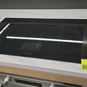 Signature Kitchen Suite SKSIT3601GE induction cooktop. Features a 36" black glass surface and touch controls.