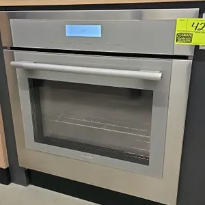 Thermador ME301WS/03 built-in oven. Features stainless steel finish, glass door, digital touch controls, and convection fan. Includes internal racks a
