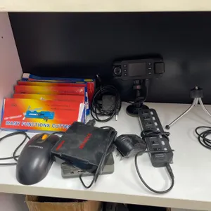 Lot of AssortedÂ Electronics Including Camera Accessories, Power Strips, and Tripods
