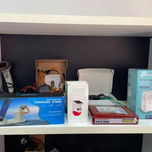 Lot of AssortedÂ Electronics Lot Including Phone Charging Stand, TP-Link Extender, and More