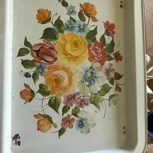 This item is a vintage metal serving tray or TV