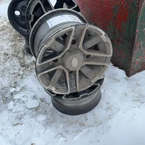 Seller #65. Set of Artic Cat 4 wheeler rims, see photos, total of eight rims in this lot