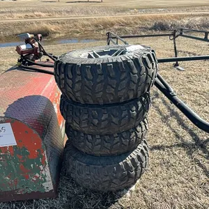 Seller #65. (4) 4 hole Coyote tire and rim. AT27x11-12