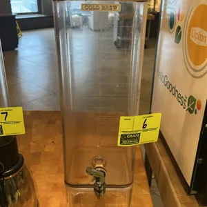 Poly beverage dispenser. Features clear construction with a dispensing spigot and lid.