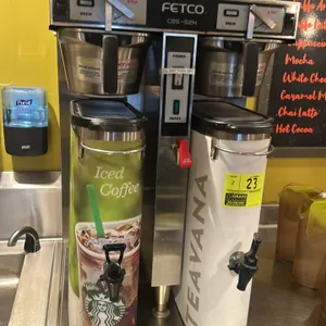 Stainless steel beverage dispenser. Features a push spigot.