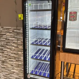 2023 QBD PC8L-HC 1-door glass display beverage cooler. Features self-contained refrigeration, LED interior lighting, and (5) wire shelves with product