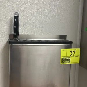 Wall-mounted knife block. Features stainless steel construction with a black slotted insert. Includes (1) knife.