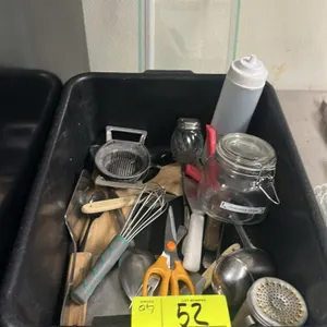 Assorted kitchenware lot. Includes whisk, scissors, ladles, spatulas, squeeze bottle, glass jars, egg slicer, and other assorted utensils. Housed in a