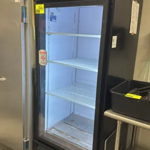 2011 QBD CD26L1T5 self-contained glass door beverage cooler. Features an illuminated "helloGoodness" top sign, LED interior lighting, and 3 wire shelv