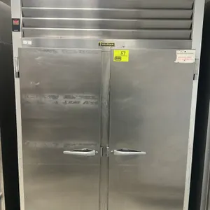 Traulsen G20010 reach-in freezer. Features 2 solid stainless steel doors and a digital temperature display. Electrical: 115V. Mounted on casters.