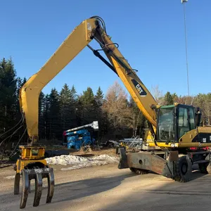 Caterpillar M318D Material Handler
