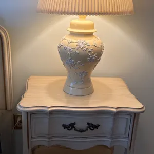 Wooden Nightstand with Drawer Featuring Decorative Table Lamp