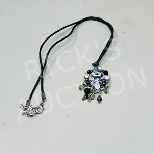 Necklace w/ carved flower pendant