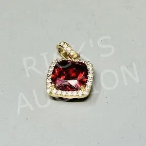 gold tone pendant w/ red & clear stones