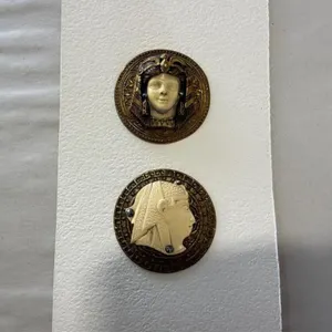 2 Egyptian head buttons, ivoroid on brass