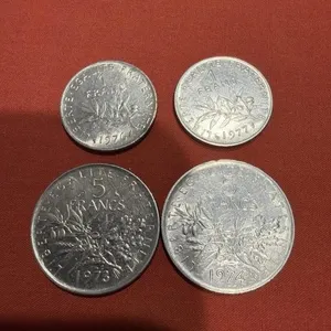 1976, 1977 1 franc coins, 1973 and 1974 5 franc