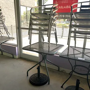 (4) Metal Patio Chairs and Square Mesh Table with Umbrella Base, 27in x 27in