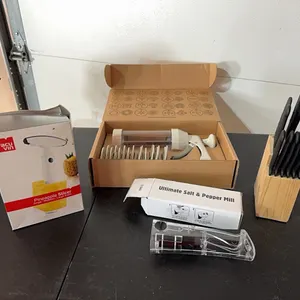 Pampered Chef cookie press, steak knives, mill, pineapple slicer
