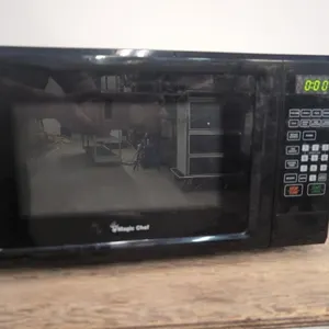 Magic Chef Microwave powers on