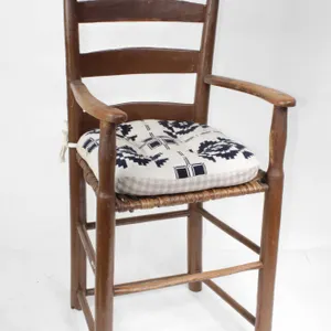 PRIMITIVE LADDER BACK CHAIR WITH WOVEN SEAT.