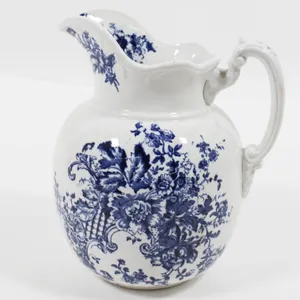 BLUE AND WHITE TRANSFERWARE PITCHER BY MADDOCKS WORKS.