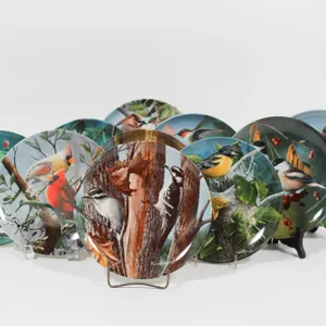 EDWIN M KNOWLES BIRD-THEMED DECORATIVE PLATES.