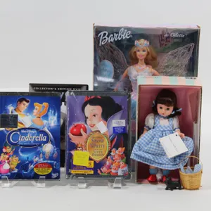 MADAME ALEXANDER DOROTHY DOLL, SWAN LAKE BARBIE, AND DVDS.