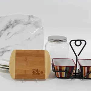 ONEIDA MARBLED PORCELAIN PLATES, LIDDED JAR, CUTTING BOARD, AND PAMPERED CHEF SERVING BOWLS.