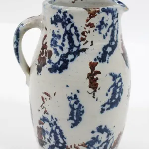 STONEWARE PITCHER WITH BLUE AND BROWN DECORATION BY CULLMAN POTTERY CO.