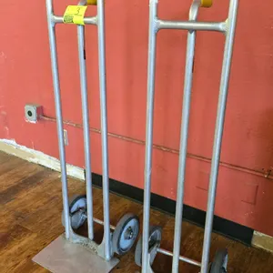 Aluminum 2-wheel hand truck. Features a single rear handle and flat plate.