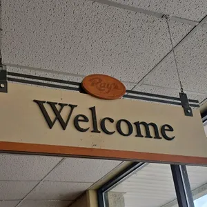 Double-sided hanging sign. Features "Welcome" on one side and "Thank You" on the reverse with raised lettering. Includes a "Ray's" oval top plaque. 3'