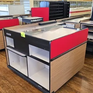Reynolds Corporation DATA 3000 Series dual belt checklane. Features woodgrain and red laminate finish, dual conveyor belts, and built-in storage shelv