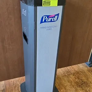 Purell metal hand sanitizing wipes kiosk. Features a freestanding base.
