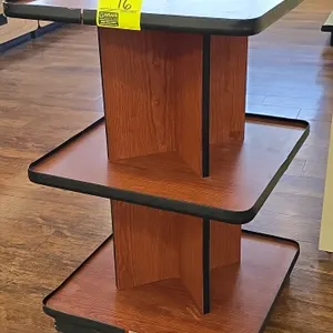3-tier merchandiser display. Features wood-grain laminate finish with black edge molding. 2' x 2'.