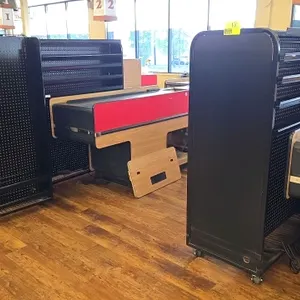 Metal portable magazine and candy rack package lot. Includes (2) 3.5' x 1.5' and (1) 3' racks. Features black metal construction with wire shelving an