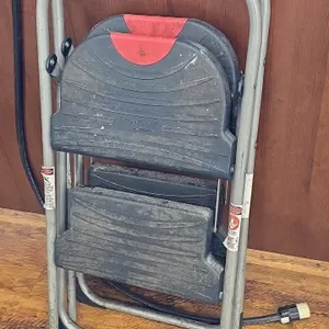 Folding 2-step step stool. Features a metal tubular frame and poly steps.