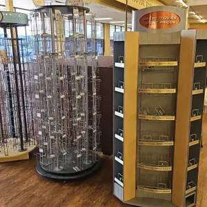 Assorted 2.5' portable merchandisers. Includes wire spinner racks and a media display rack. Contents not included.