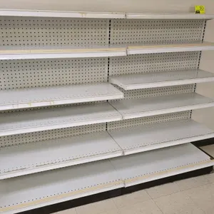 6'L of Lozier wall shelving. 55"H uprights with 16"D base shelves. Features white pegboard backing and adjustable upper shelves.